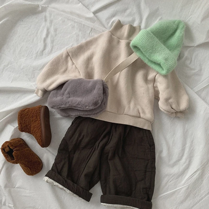 Winter new children's clothing loose and versatile loose shoulders simple western solid color high-neck fleece sweater 20D929
Winter new children's clothing loose and versatile loose shoulders simple western solid color high-neck fleece sweater 20D929