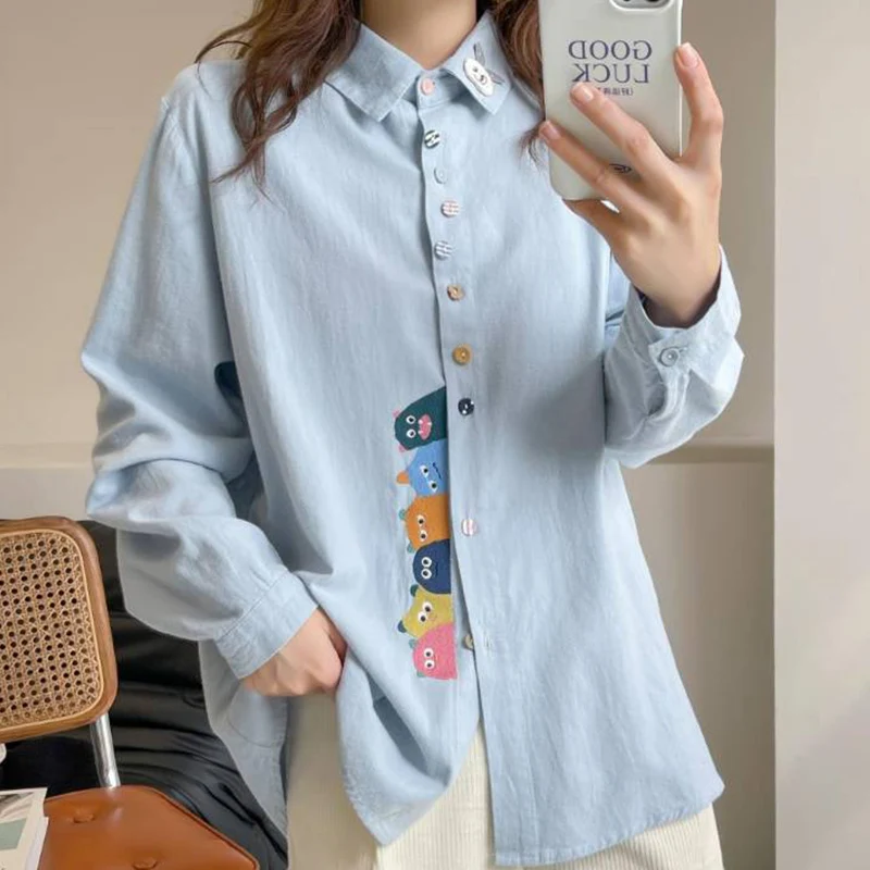 Spring Casual Sweet Cartoon Grinding Hair Embroidery Shirt Women Blue Pink Loose Turn Down Collar Female Kawaii Blouse Tops U074
Spring Casual Sweet Cartoon Grinding Hair Embroidery Shirt Women Blue Pink Loose Turn Down Collar Female Kawaii Blouse Tops U074