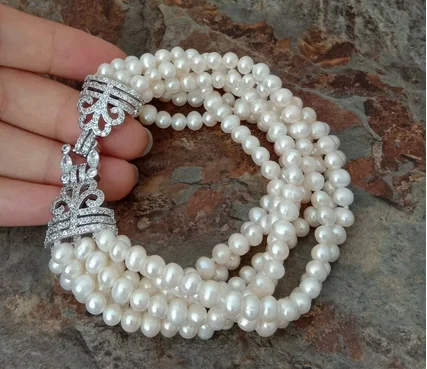 8" 7 strands 5-6mm White freshwater Pearl Bracelet Cz Clasp
8" 7 strands 5-6mm White freshwater Pearl Bracelet Cz Clasp
