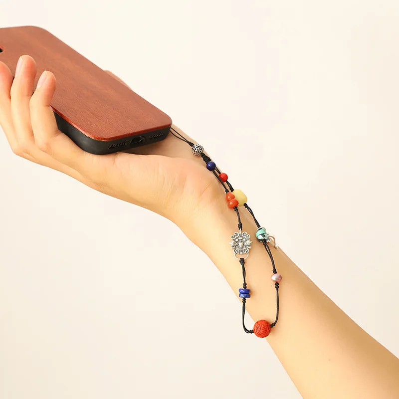 Design auspicious Duobao South Red Honey Wax Pearl Mobile phone bracelet wrist strap hand woven cord simple jewelry
Design auspicious Duobao South Red Honey Wax Pearl Mobile phone bracelet wrist strap hand woven cord simple jewelry