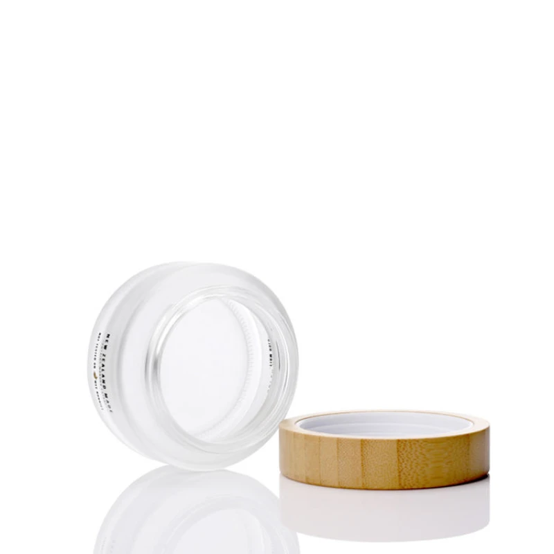 Custom Cosmetic Packaging Skincare Body Lotion Empty Container Frosted Cosmetic Cream Glass Jar with Natural Bamboo Lid
Custom Cosmetic Packaging Skincare Body Lotion Empty Container Frosted Cosmetic Cream Glass Jar with Natural Bamboo Lid