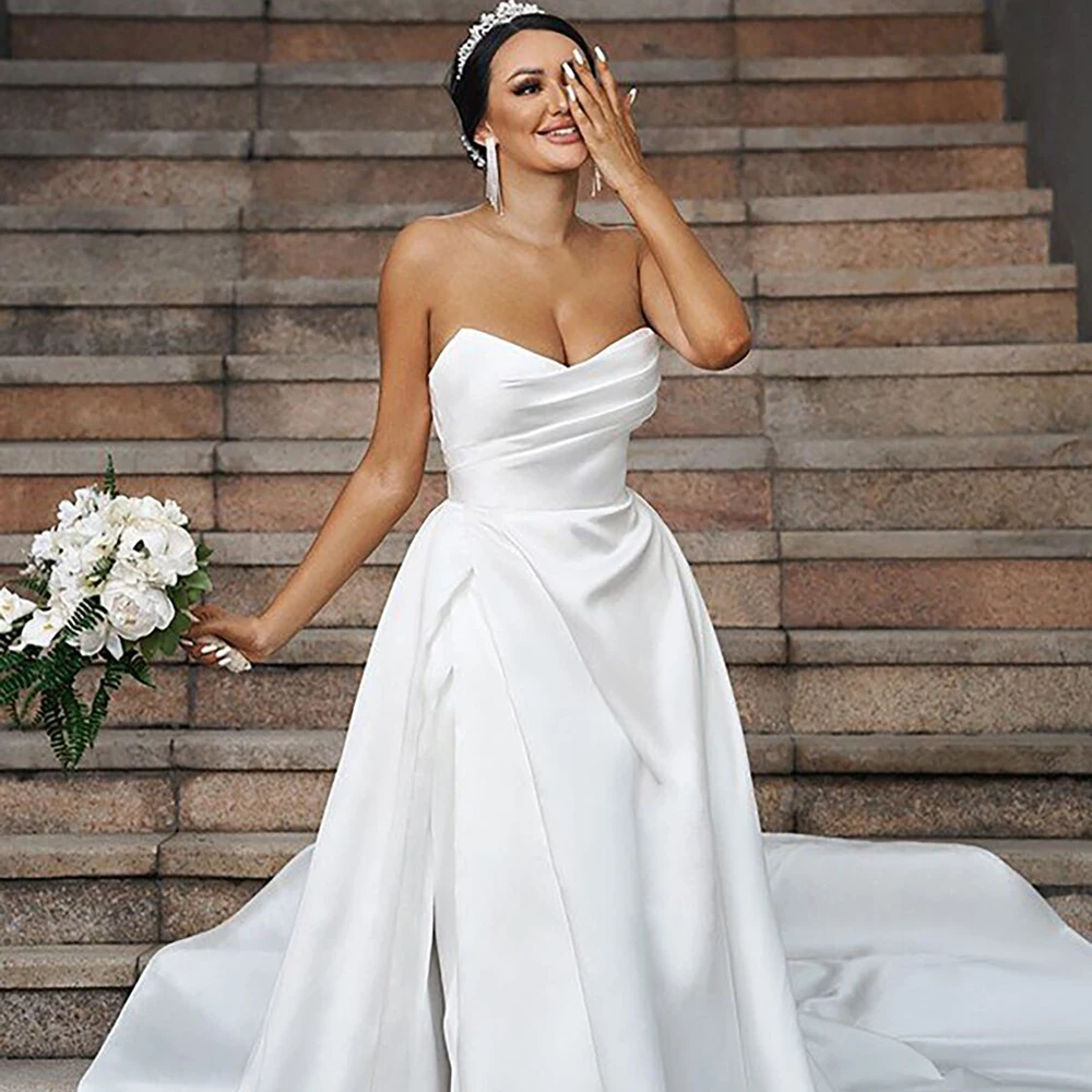 Modern Ivory Sweetheart A-Line Wedding Dress Elegant Pleated Satin Wedding Gowns Backless Court Train Bridal Dress 2023
Modern Ivory Sweetheart A-Line Wedding Dress Elegant Pleated Satin Wedding Gowns Backless Court Train Bridal Dress 2023