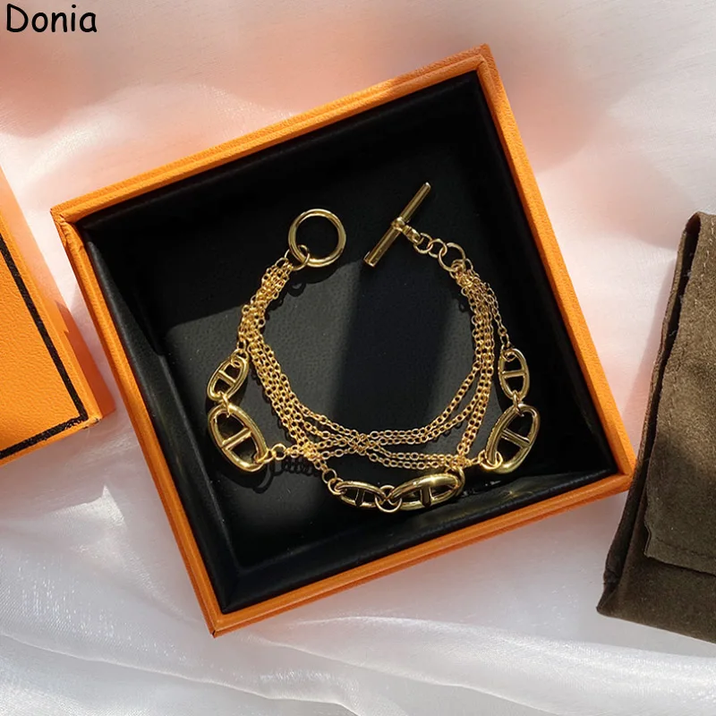 

Donia Jewelry New European and American Fashion Pig Nose Smooth Titanium OT Buckle Palace Luxury Retro Bracelet.