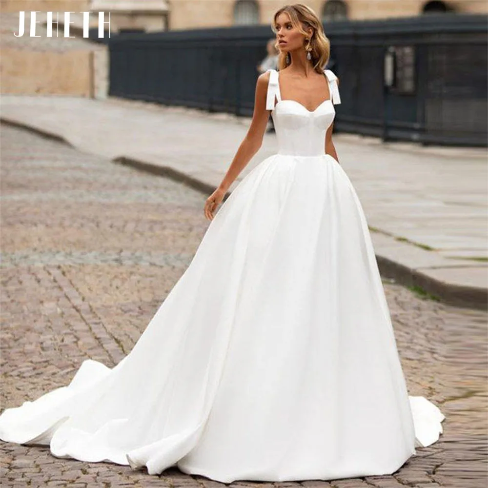 JEHETH Bow Spaghetti Straps Satin Princess Wedding Dresses A-line Open Back Bridal Party Gowns With Court Train Robe De Mariée
JEHETH Bow Spaghetti Straps Satin Princess Wedding Dresses A-line Open Back Bridal Party Gowns With Court Train Robe De Mariée