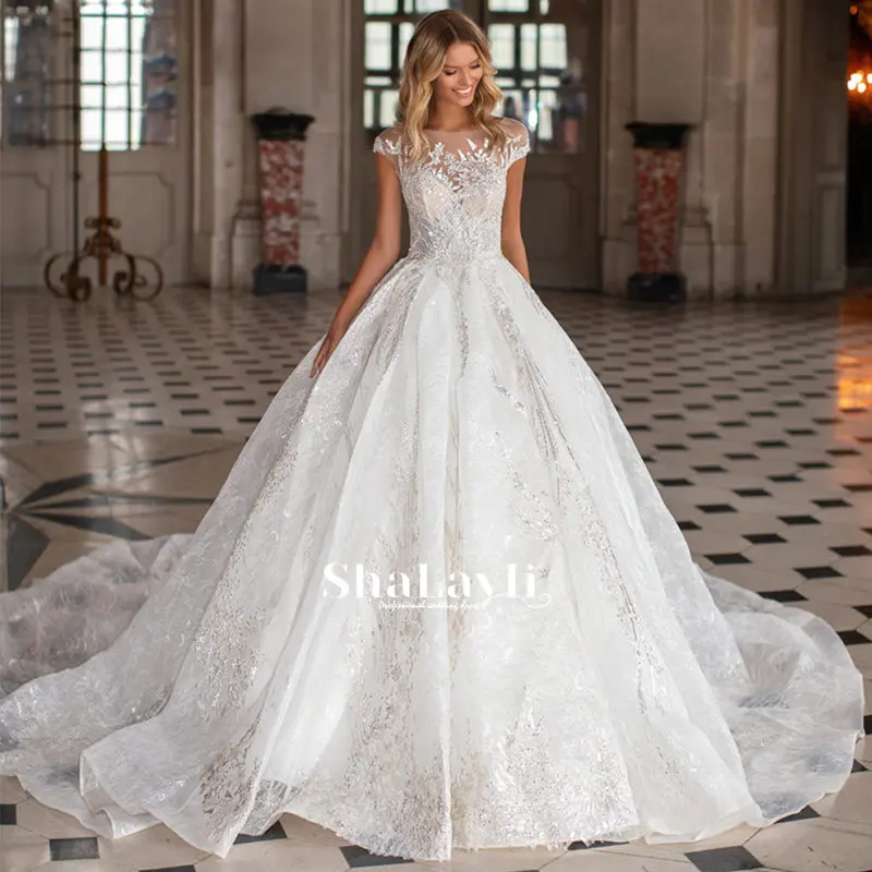 Scoop Ball Gown Lace Wedding Dresses Shiny Applique Sequins Cap Sleeve Bride Dress Cathedral Train Bridal Gown Plus Size Button
Scoop Ball Gown Lace Wedding Dresses Shiny Applique Sequins Cap Sleeve Bride Dress Cathedral Train Bridal Gown Plus Size Button