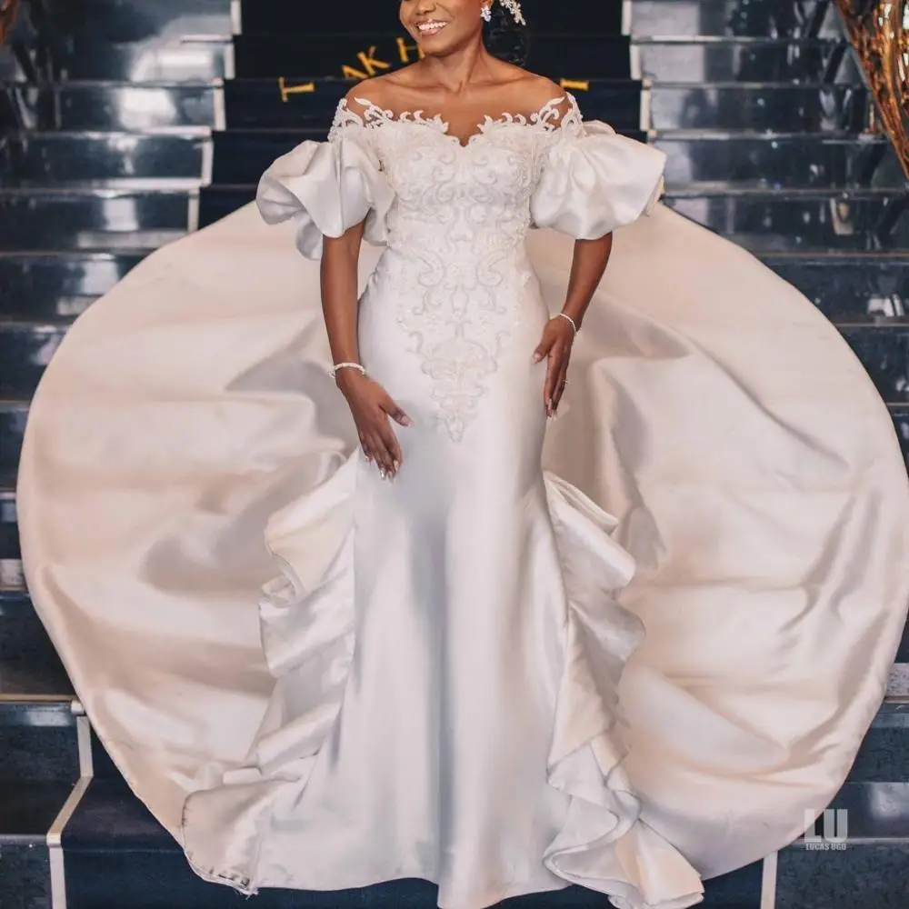 Beauty Puffy Sleeves Appliques Pearls Mermaid Wedding Dresses Chapel Train Vintage Buttons Back Bridal Gowns Abiti da Sposa 2023
Beauty Puffy Sleeves Appliques Pearls Mermaid Wedding Dresses Chapel Train Vintage Buttons Back Bridal Gowns Abiti da Sposa 2023