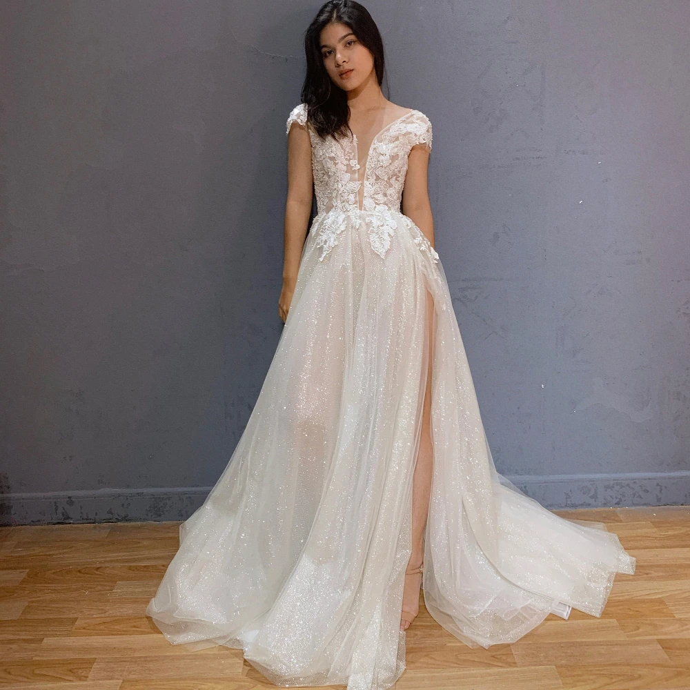 Elegant A Line Wedding Dresses Charming Appliques V Neck Sleeveless Bridal Gowns Sexy Open Back Side Split Vestido de Novia
Elegant A Line Wedding Dresses Charming Appliques V Neck Sleeveless Bridal Gowns Sexy Open Back Side Split Vestido de Novia