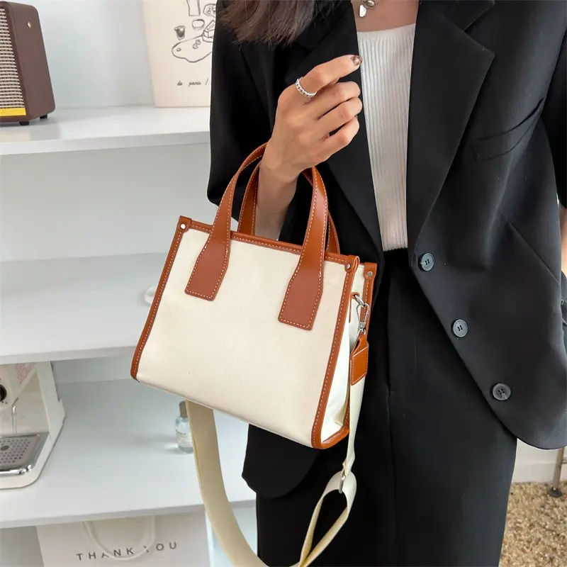 2022 New women fashion simple canvas stitching messenger bag ladies tote bag medium handbag
2022 New women fashion simple canvas stitching messenger bag ladies tote bag medium handbag