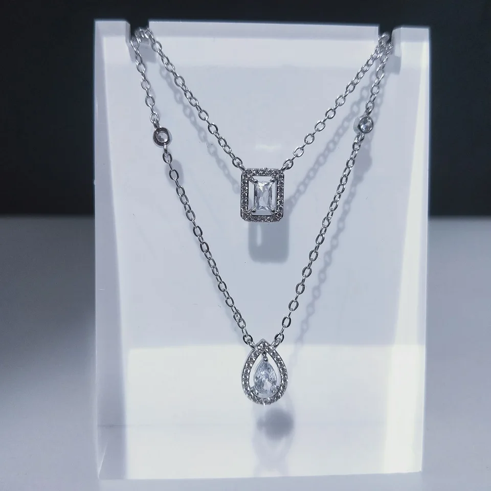 RAKOL 2022 New Luxury White Water Drop Square Cubic Zirconia Double Layer Pendant Necklace for Women Fashion Anniversary Gifts
RAKOL 2022 New Luxury White Water Drop Square Cubic Zirconia Double Layer Pendant Necklace for Women Fashion Anniversary Gifts