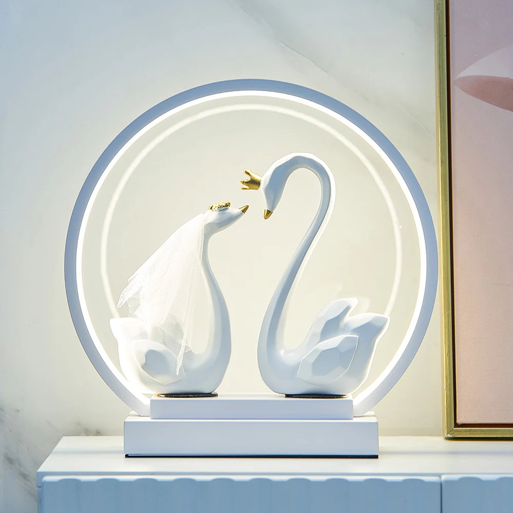 Modern home decoration couple swan lamp table lamp bedroom desktop creative animal sculpture bedside lamp romantic wedding gift
Modern home decoration couple swan lamp table lamp bedroom desktop creative animal sculpture bedside lamp romantic wedding gift