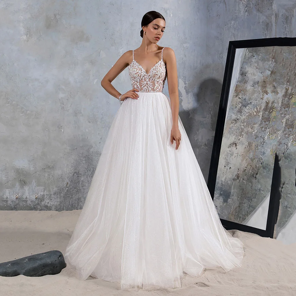 Bling Tulle Wedding Dresses with Pockets V Neck Spaghetti Strap A-line Beach Sleeveless Bridal Gowns Vestido de Novia Plus Size
Bling Tulle Wedding Dresses with Pockets V Neck Spaghetti Strap A-line Beach Sleeveless Bridal Gowns Vestido de Novia Plus Size