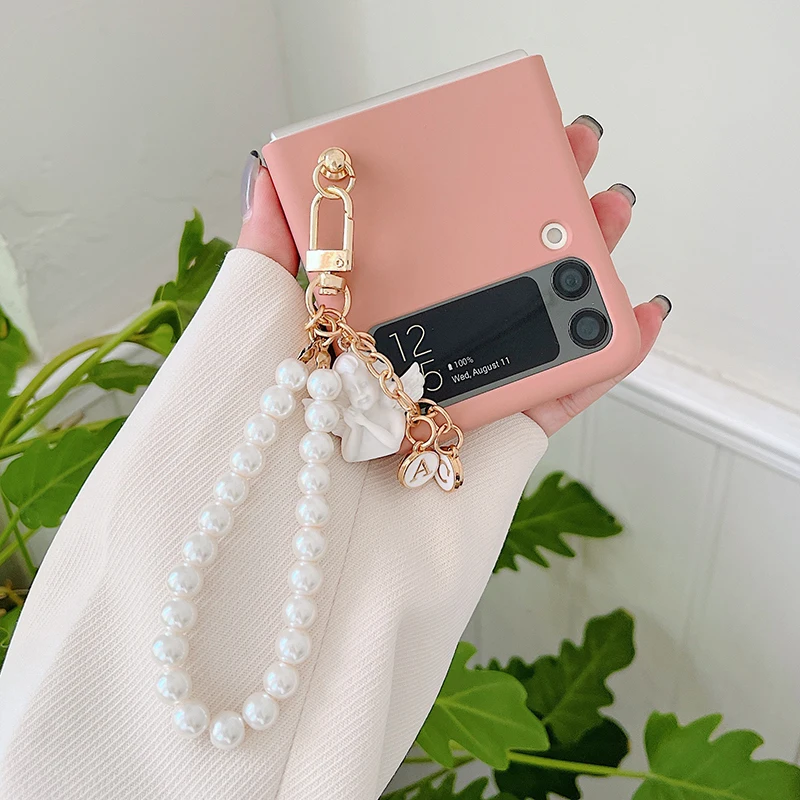 Korean Z Flip3 Plain Color Phone Case For Samsung Galaxy Z Flip 3 5G 3D Cartoon Angel Baby Pendant With Pearl Bracelet Cover
Korean Z Flip3 Plain Color Phone Case For Samsung Galaxy Z Flip 3 5G 3D Cartoon Angel Baby Pendant With Pearl Bracelet Cover