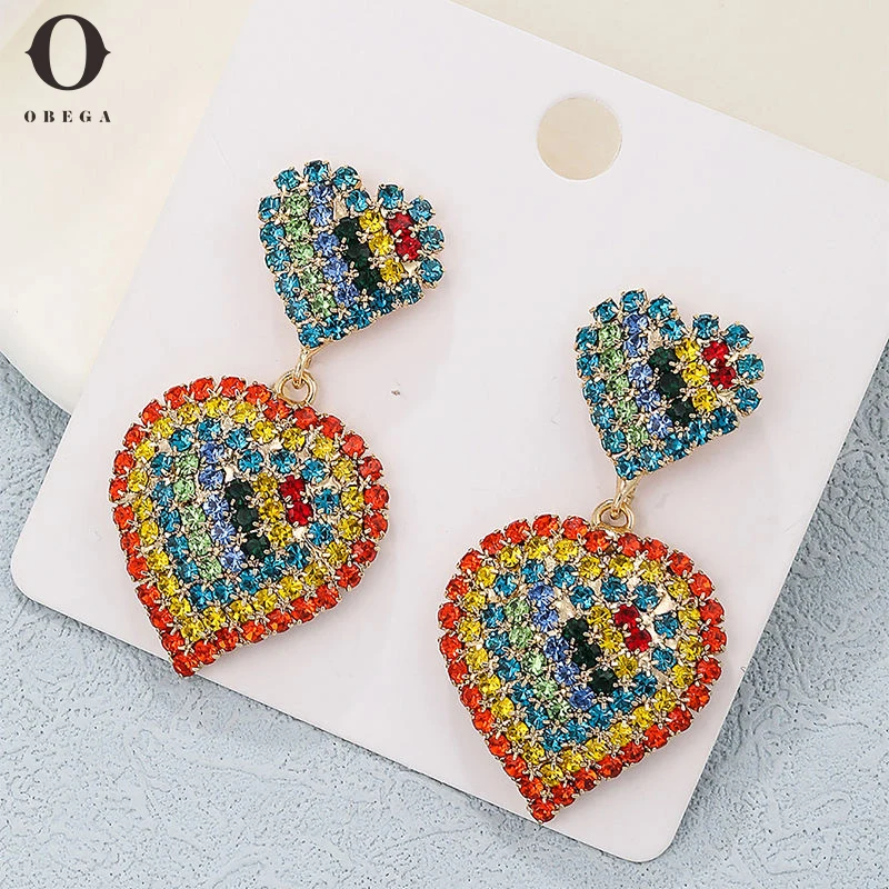 Женские серьги-подвески в виде сердца с фианитами
Женские серьги-подвески в виде сердца с фианитами