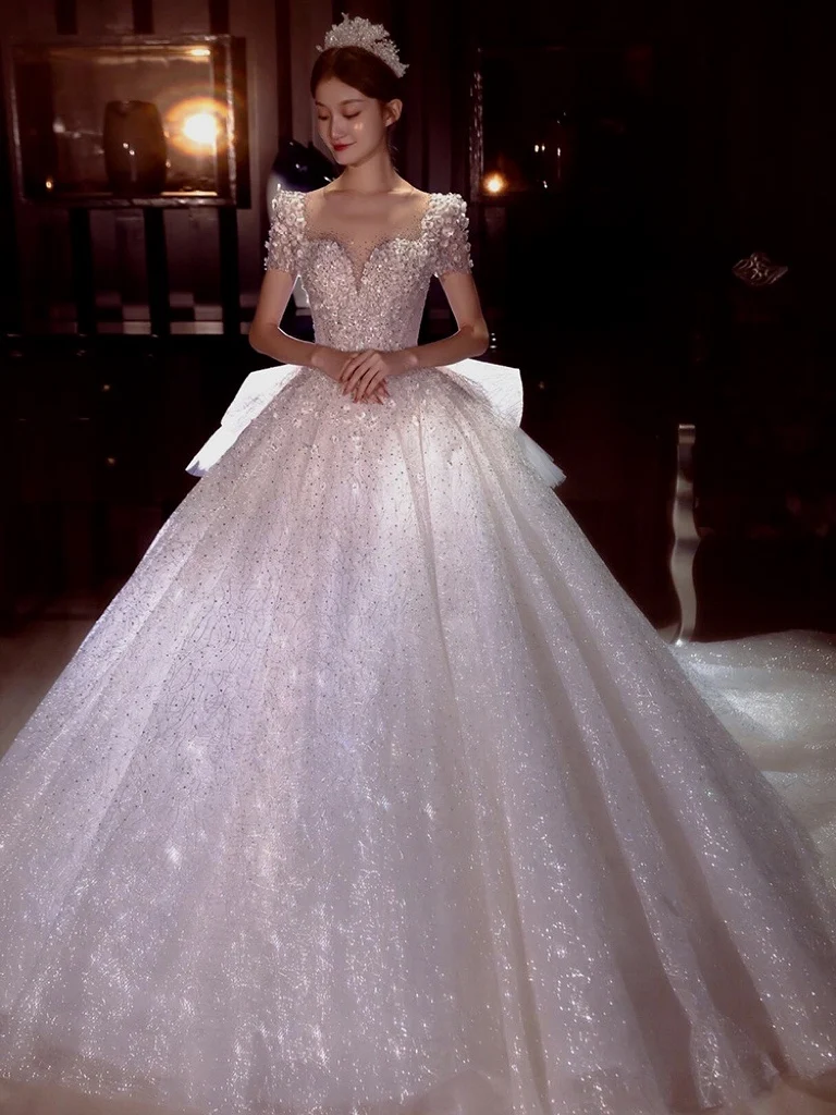 Ruffle Gorgeous Wedding Dress White Glitter Crystal Beading Applique Shinny O Neck Short Sleeve Long Trail Bride Dress Ball Gown
Ruffle Gorgeous Wedding Dress White Glitter Crystal Beading Applique Shinny O Neck Short Sleeve Long Trail Bride Dress Ball Gown