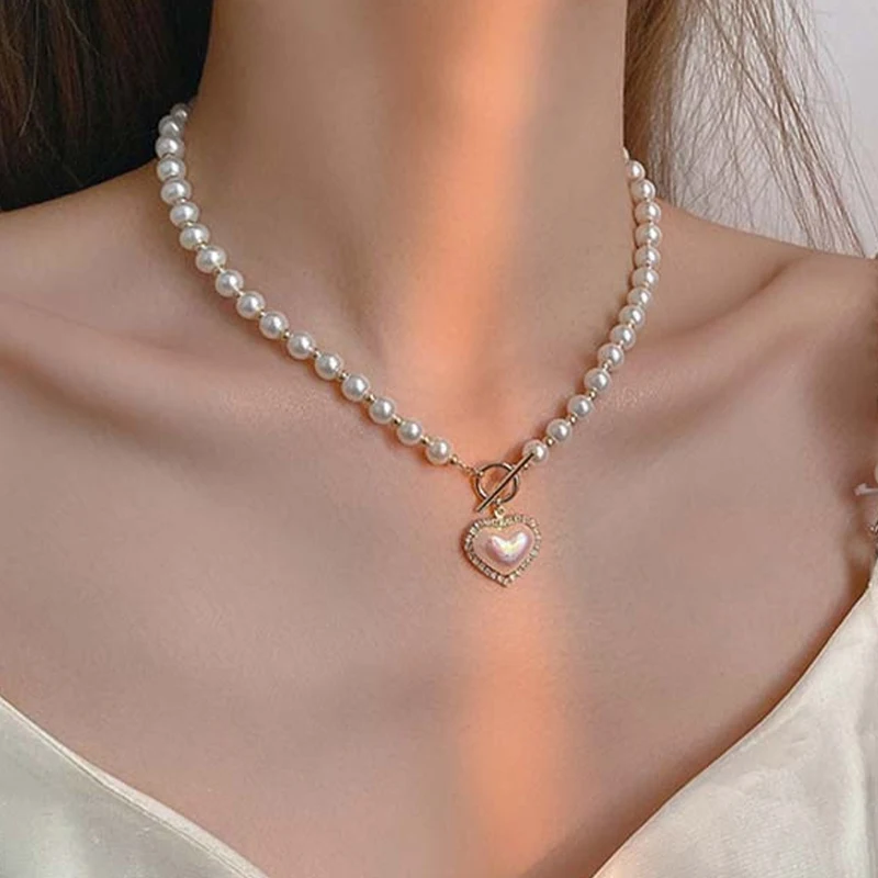 Luxury Designer Elegant Pearl Beads Necklace For Women Ladies Fashion Rhinestone Shell Heart Pendent Necklace Choker Jewelry
Luxury Designer Elegant Pearl Beads Necklace For Women Ladies Fashion Rhinestone Shell Heart Pendent Necklace Choker Jewelry