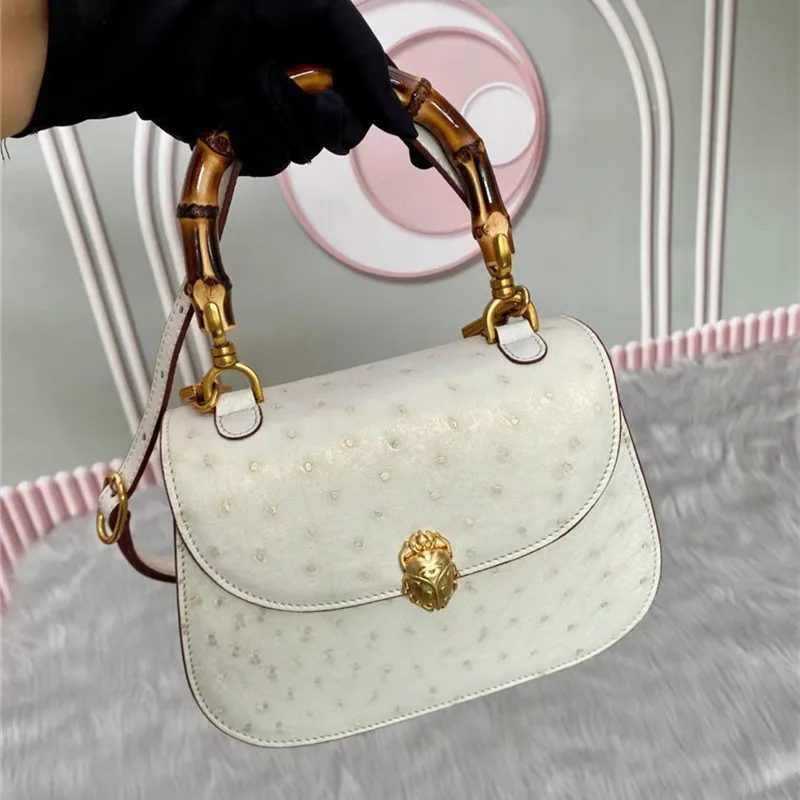 Authentic Real True Ostrich Skin Bamboo Top Handle Women's Saddle Purse Female Handbag Genuine Leather Lady Small Shoulder Bag
Authentic Real True Ostrich Skin Bamboo Top Handle Women's Saddle Purse Female Handbag Genuine Leather Lady Small Shoulder Bag