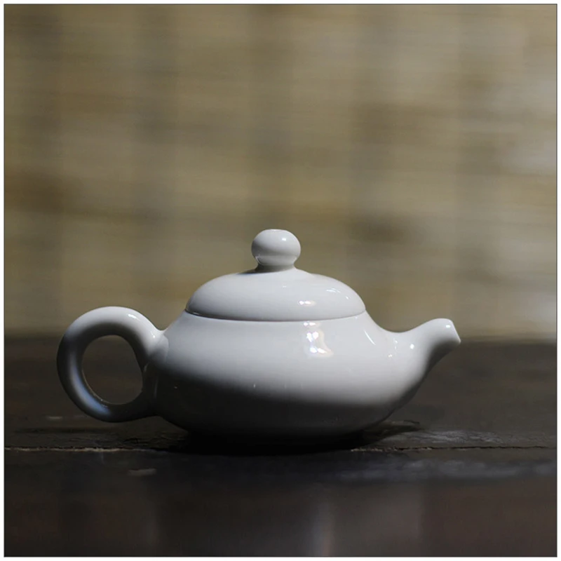 100ml Chaozhou Ceramic Teapot Antique water Pot Chinese Kung Fu Tea Set Solid White Porcelain Semi-handmade Tea Pot
100ml Chaozhou Ceramic Teapot Antique water Pot Chinese Kung Fu Tea Set Solid White Porcelain Semi-handmade Tea Pot