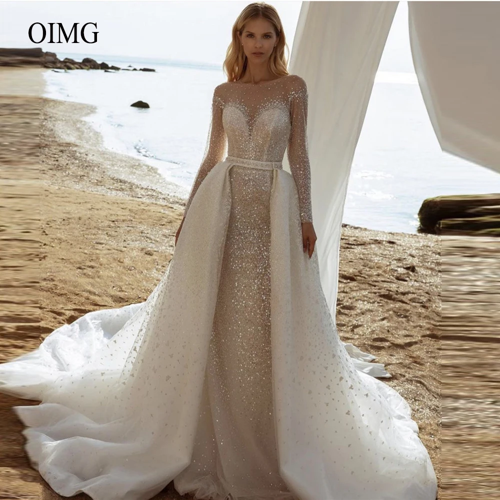 OIMG Glitter Long Sleeves Wedding Dresses With Detachable Train Sheer Neck Dubai Luxury Sparkly Bridal Gowns Buttons Back
OIMG Glitter Long Sleeves Wedding Dresses With Detachable Train Sheer Neck Dubai Luxury Sparkly Bridal Gowns Buttons Back