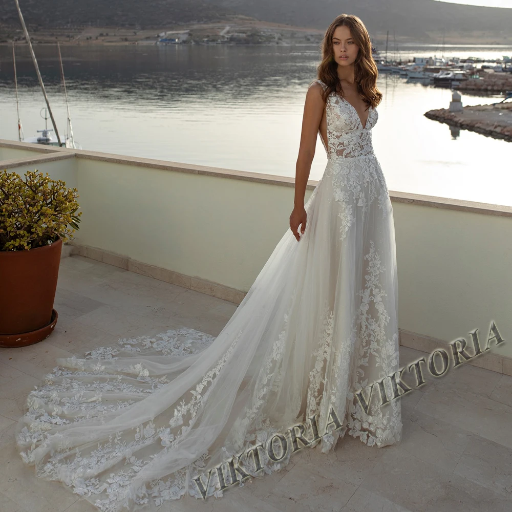 Женское свадебное платье с открытой спиной, V-образным вырезом и аппликацией
Женское свадебное платье с открытой спиной, V-образным вырезом и аппликацией