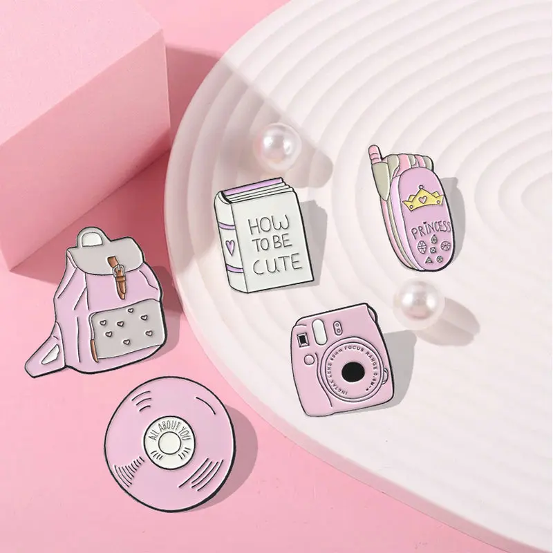 10 PCS / LOT Backpack Book Camera Mobile phone CD Enamel Pin Custom Badges Pink Girl Brooches Lapel Pins Denim Shirt Collar
10 PCS / LOT Backpack Book Camera Mobile phone CD Enamel Pin Custom Badges Pink Girl Brooches Lapel Pins Denim Shirt Collar
