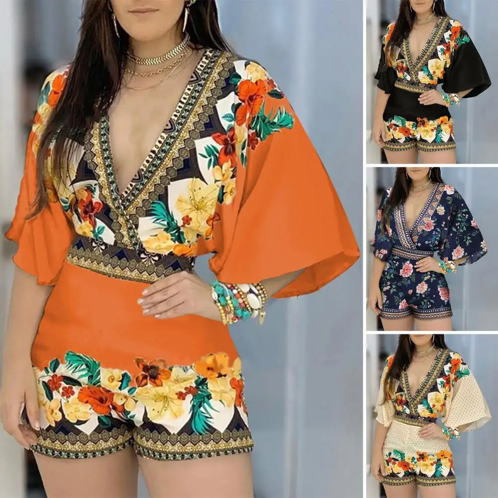 Женский комбинезон с глубоким V-образным вырезом, полурукавом-фонариком и цветочным принтом 
Женский комбинезон с глубоким V-образным вырезом, полурукавом-фонариком и цветочным принтом