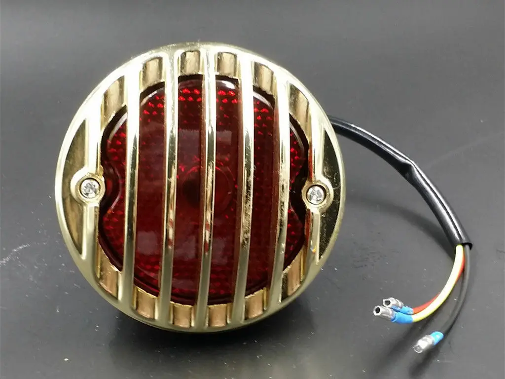 Gold GRILLE RODDER FINNED Tail Brake Light For Harley RAT HOT ROD DUO CAFE RACER
Gold GRILLE RODDER FINNED Tail Brake Light For Harley RAT HOT ROD DUO CAFE RACER