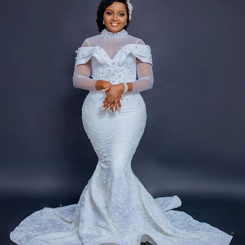 Beauty Heavy Pearls High Neck African Wedding Dress 2023Sweep Train Vestidos De Novia Long Sleeves Lace Bridal Gowns
Beauty Heavy Pearls High Neck African Wedding Dress 2023Sweep Train Vestidos De Novia Long Sleeves Lace Bridal Gowns