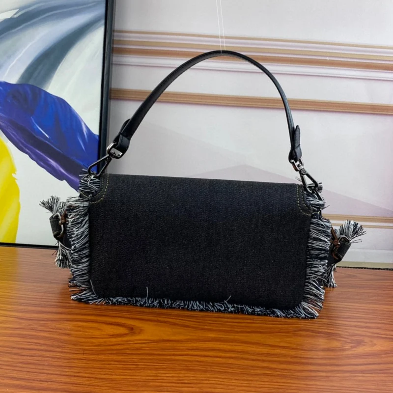 Fashion denim tassel handbag retro shoulder bag classic designer underarm bag casual Joker star flip bag with the same bag.
Fashion denim tassel handbag retro shoulder bag classic designer underarm bag casual Joker star flip bag with the same bag.