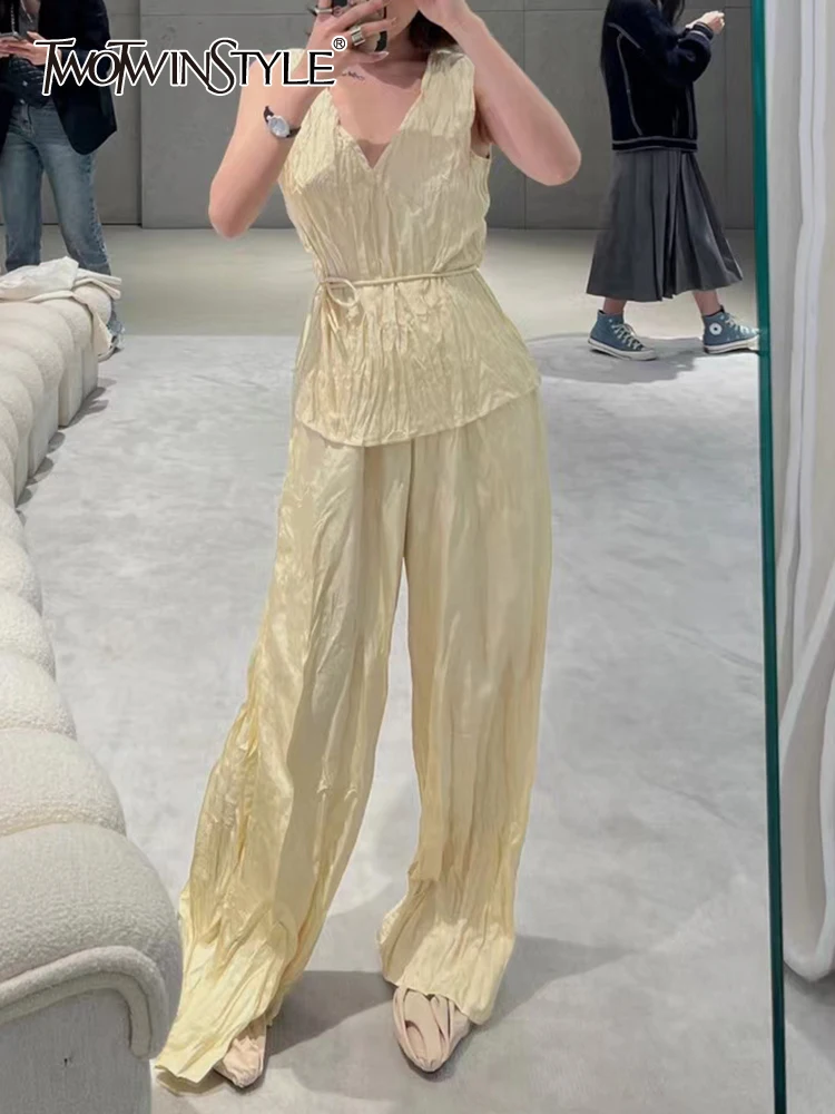 TWOTWINSTYLE Solid Two Piece Sets For Women V Neck Sleeveless Tops High Waist Loose Summer Wide Leg Pants Summer Set Female New
TWOTWINSTYLE Solid Two Piece Sets For Women V Neck Sleeveless Tops High Waist Loose Summer Wide Leg Pants Summer Set Female New