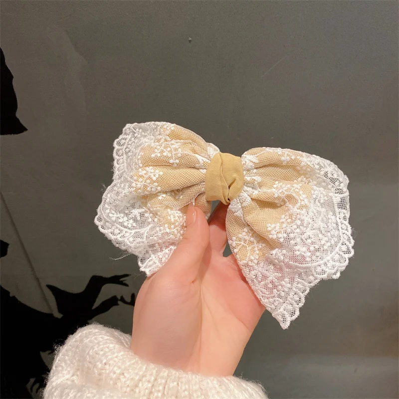 Japanese and Korean sweet bow top clip high sense lace double-layer high skull top back hairpin female headdress
Japanese and Korean sweet bow top clip high sense lace double-layer high skull top back hairpin female headdress