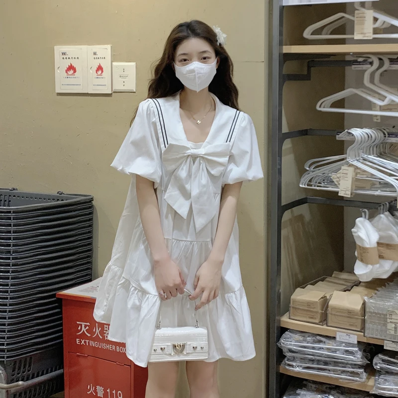 College style Navy collar bow dress summer 2022 new age reduction design sense bubble short sleeve middle skirt women
College style Navy collar bow dress summer 2022 new age reduction design sense bubble short sleeve middle skirt women