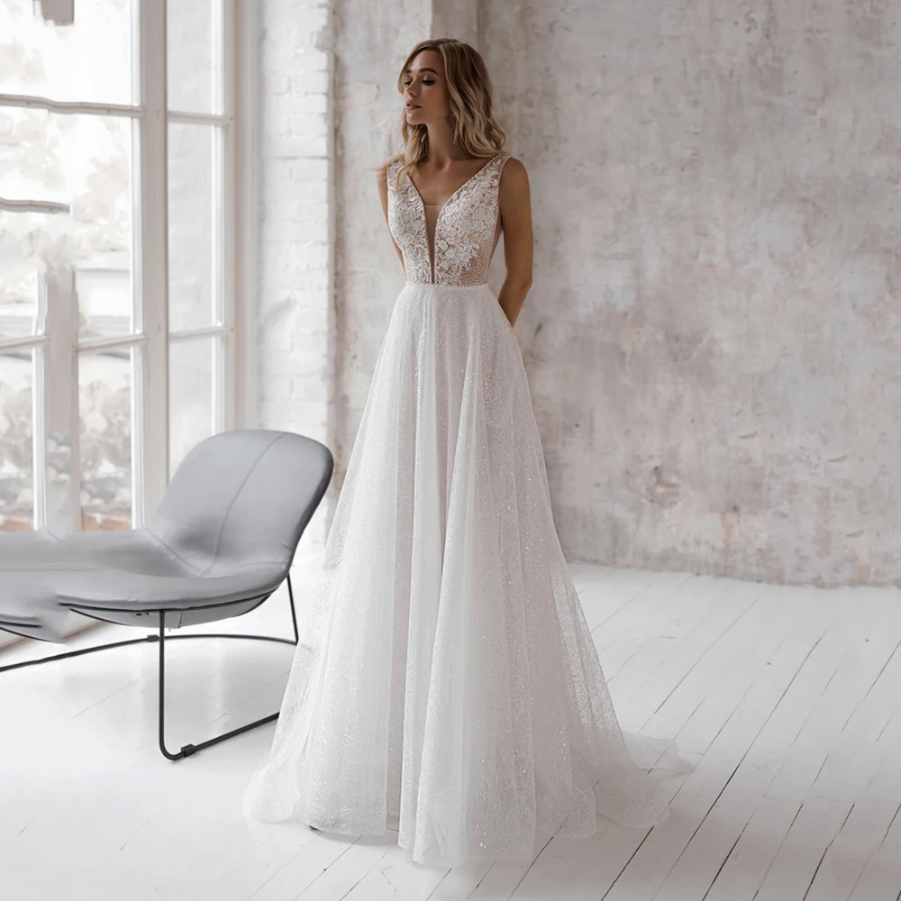 Elegant Glitter A-Line Wedding Dress V-Neck Lace Appliques Sleeveless Beading Bridal Gown Sexy Brides Dress With Pocket
Elegant Glitter A-Line Wedding Dress V-Neck Lace Appliques Sleeveless Beading Bridal Gown Sexy Brides Dress With Pocket
