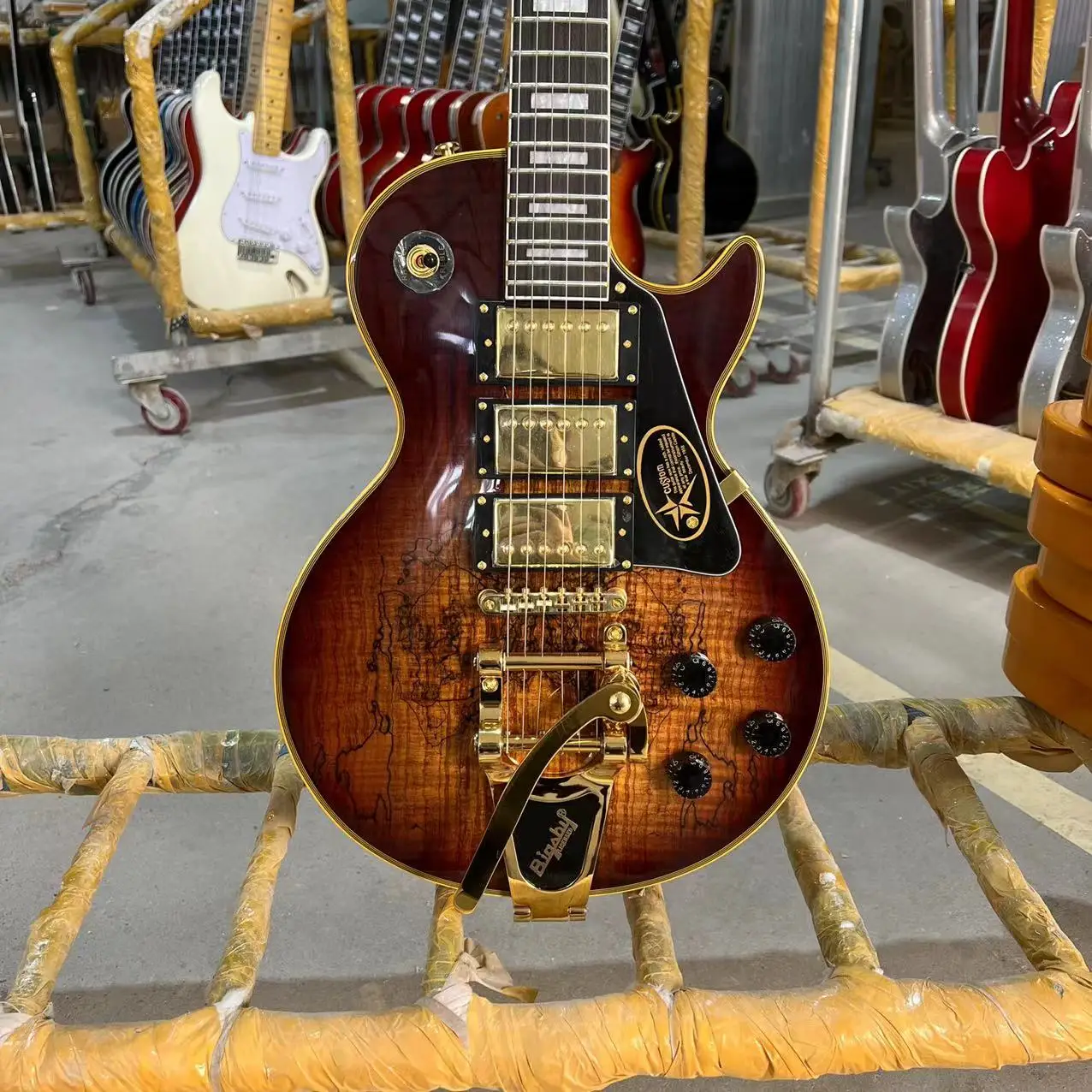 

Custom Electric Guitar Decayed Maple Top with Bigsby Tremolo Bridge Yellow Binding Gold Hardware Tobacco Sunburst Color