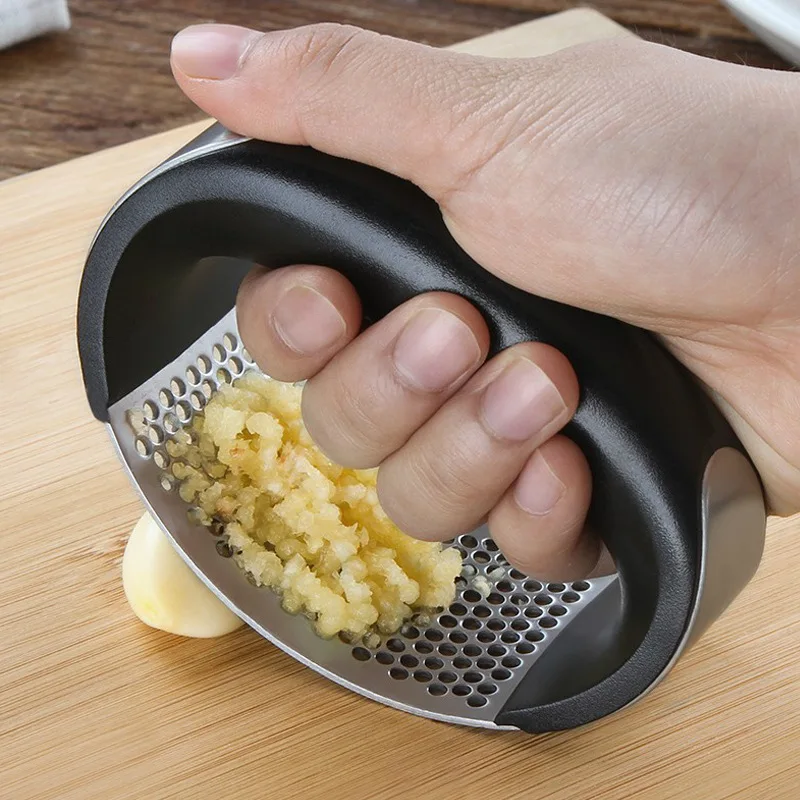 Manual Stainless Steel Garlic Press Manual Garlic Mincer Chopping Garlic Tools Curve Fruit Vegetable Tools Kitchen Gadgets Items
Manual Stainless Steel Garlic Press Manual Garlic Mincer Chopping Garlic Tools Curve Fruit Vegetable Tools Kitchen Gadgets Items