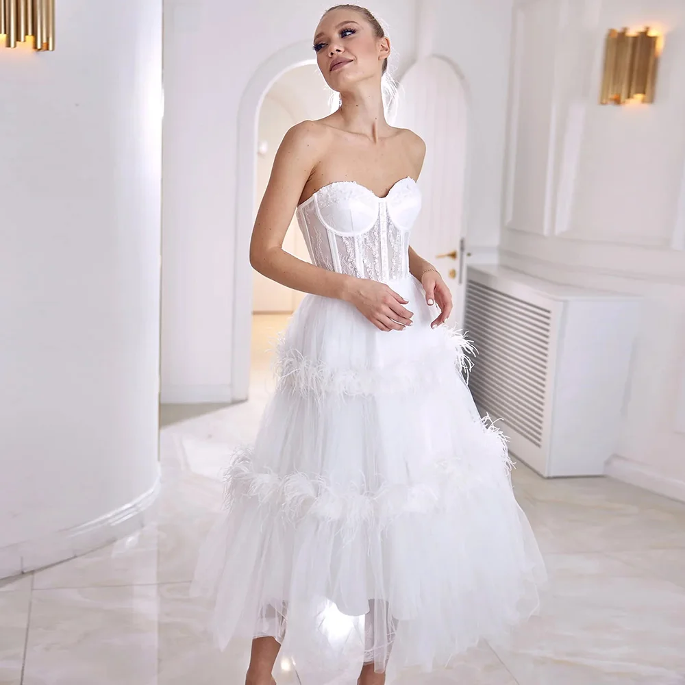 White Sweetheart Evening Dresses for Women Tea Length Tulle Feathers Open Back A-Line Wedding Party Gowns Customized فستان سهرة
White Sweetheart Evening Dresses for Women Tea Length Tulle Feathers Open Back A-Line Wedding Party Gowns Customized فستان سهرة