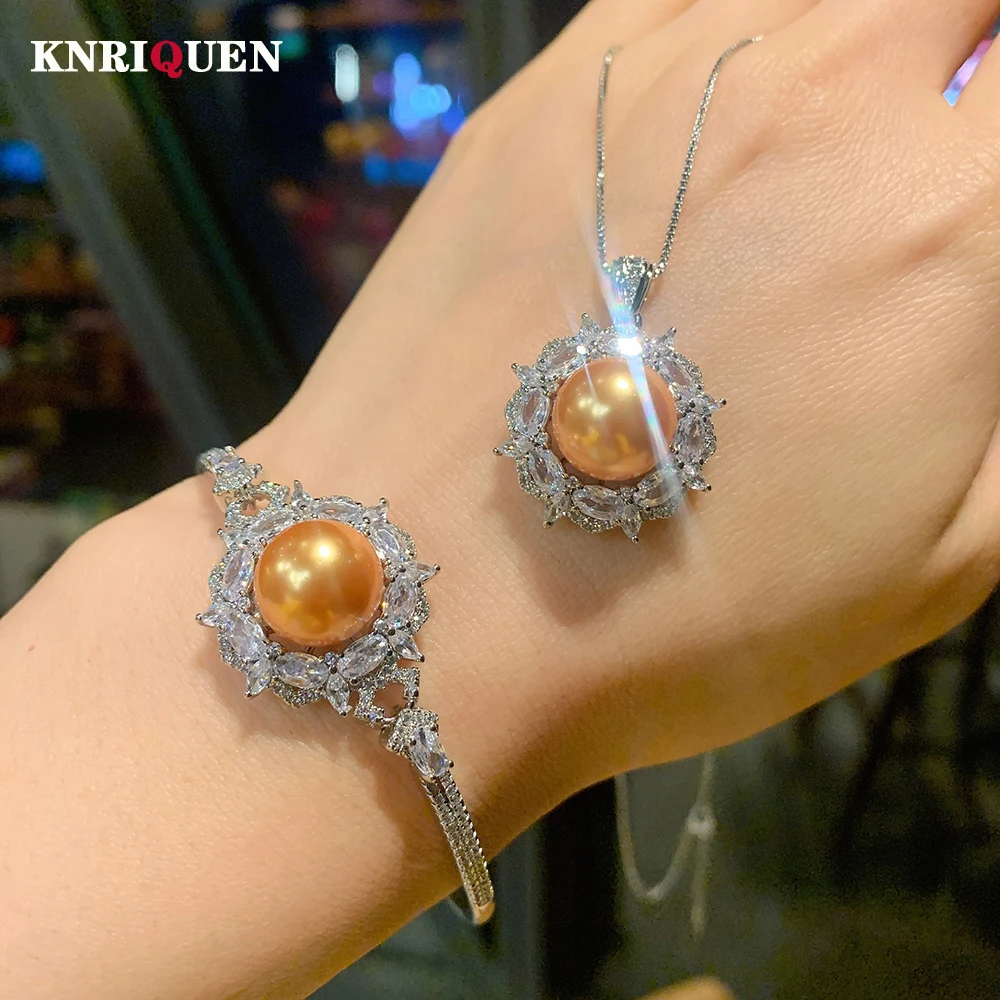 Charms 925 Sterling Silver 14mm Gold Big Pearl Lab Diamond Pendant Necklace Bracelets for Women Wedding Party Jewelry Sets Gift
Charms 925 Sterling Silver 14mm Gold Big Pearl Lab Diamond Pendant Necklace Bracelets for Women Wedding Party Jewelry Sets Gift