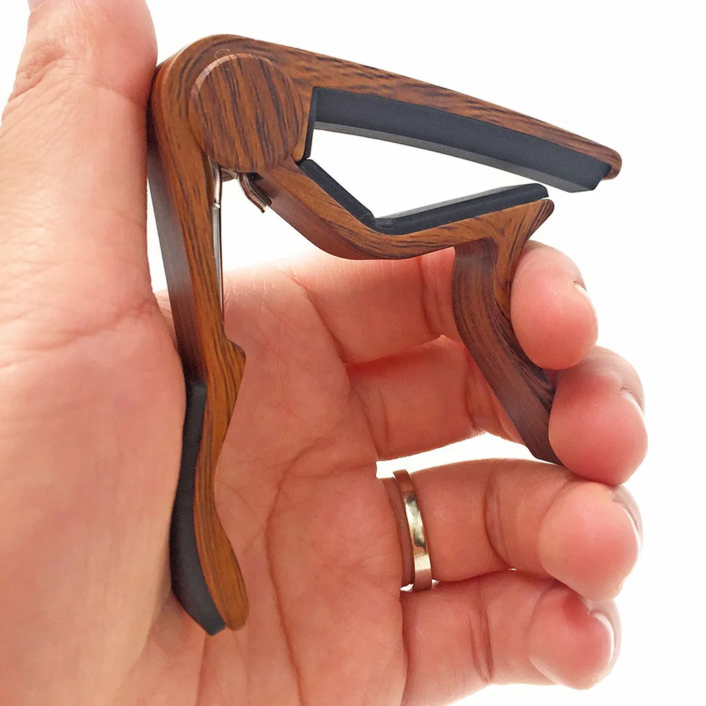 Quick-Change Guitar Capo Portable Clip-On Tuner Musical Instrument Fixing Adjustment Tool
Quick-Change Guitar Capo Portable Clip-On Tuner Musical Instrument Fixing Adjustment Tool