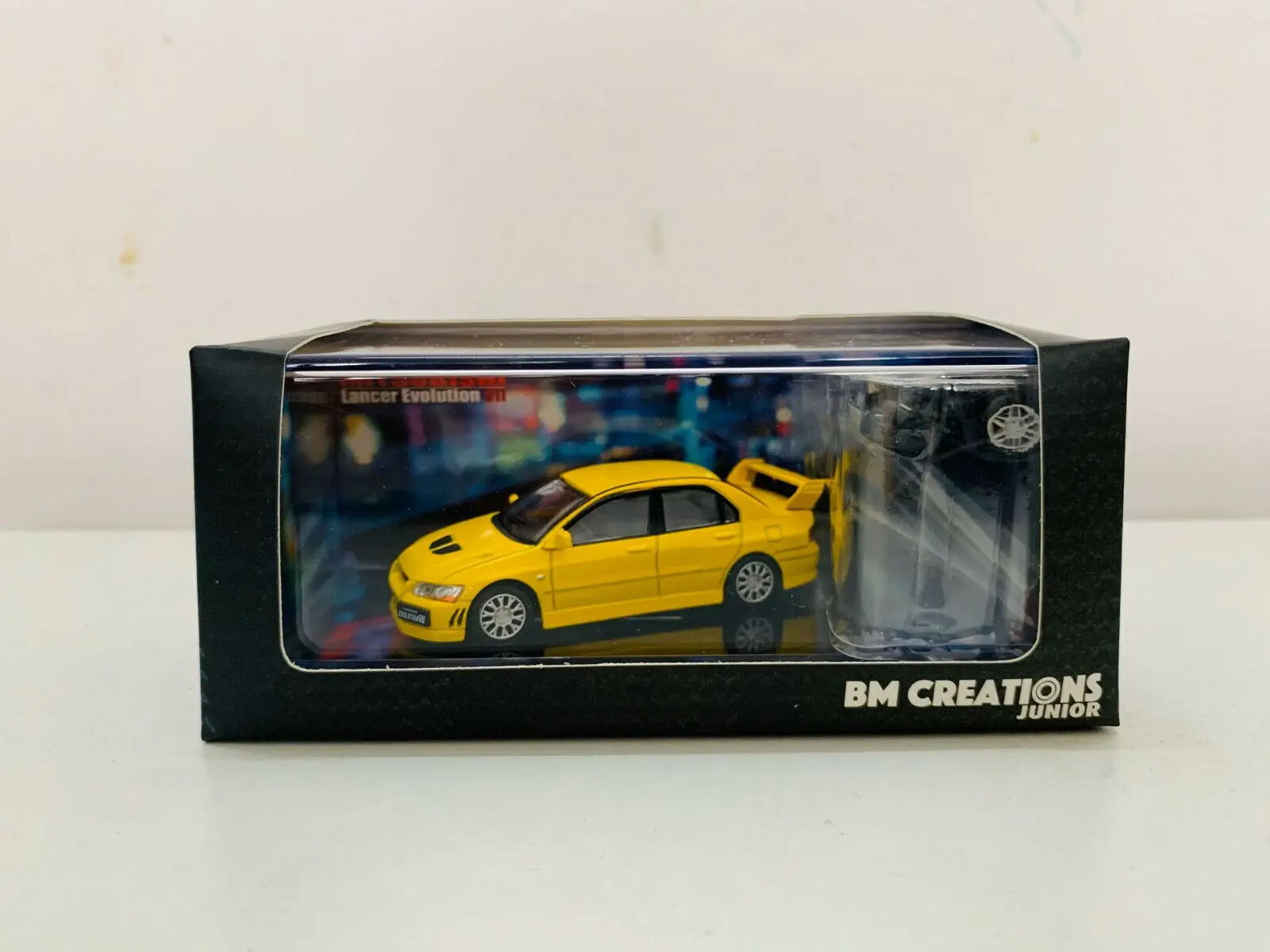 

BM Creations Junior Mitsubish i Lancer Evolution VII Yellow (LHD) 1/64 Scale DieCast Model Car
