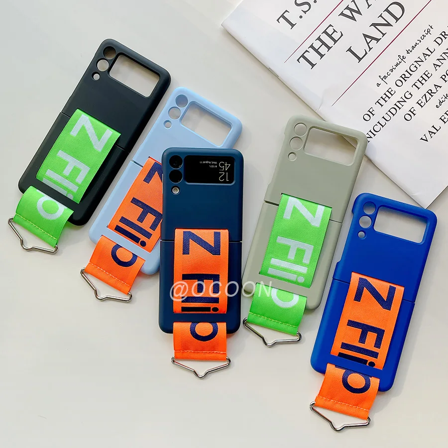 Fashion Hand Strap Phone Case For Samsung Galaxy Z Flip 3 5G Coque Ultra Thin Hard Plastic Cover Wristband Ring Shockproof Cover
Fashion Hand Strap Phone Case For Samsung Galaxy Z Flip 3 5G Coque Ultra Thin Hard Plastic Cover Wristband Ring Shockproof Cover