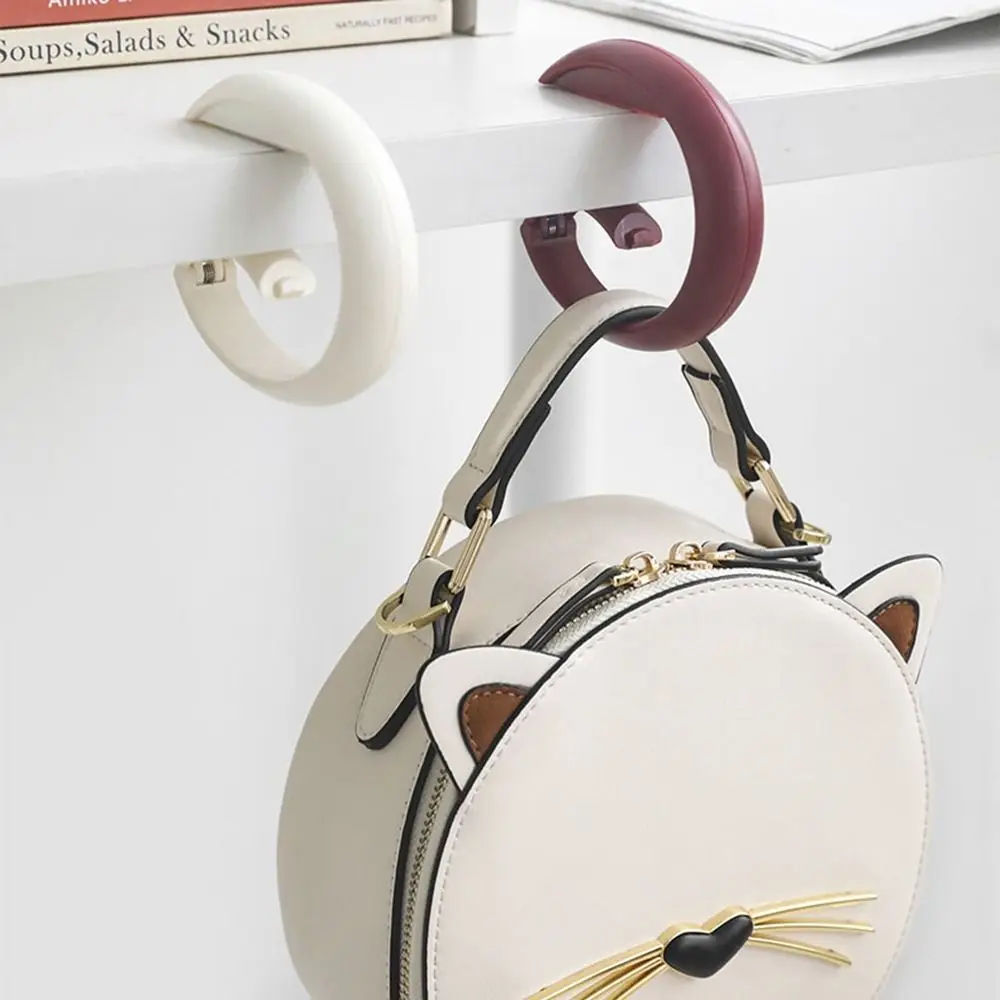 Multi-functional Portable Bag Hook Creative Foldable Punch-free Table Edge Hook Plastic Seamless Handbag Hanger Handbag
Multi-functional Portable Bag Hook Creative Foldable Punch-free Table Edge Hook Plastic Seamless Handbag Hanger Handbag