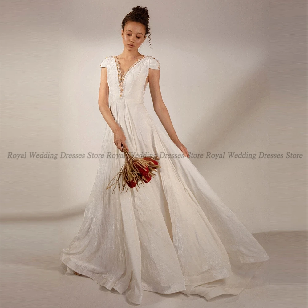 High Quality A Line Wedding Dresses V Neck Tulle Draped Sequin Applique Open Back 2022 Summer Floor Length Gowns Robe De Ma
High Quality A Line Wedding Dresses V Neck Tulle Draped Sequin Applique Open Back 2022 Summer Floor Length Gowns Robe De Ma