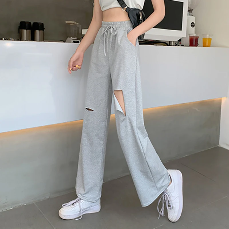 Fashion Ripped Woman Pants Casual Solid Women's Sports Pants Summer Loose Elastic Waist Sweatpants Harajuku Pants for Female
Fashion Ripped Woman Pants Casual Solid Women's Sports Pants Summer Loose Elastic Waist Sweatpants Harajuku Pants for Female