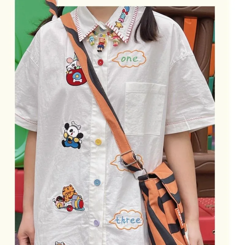2023 Japanese Peter Pan Collar Women Blouse Cartoon Embroidery Sweet Preppy Shirts All Match Harajuku Casual Short Sleeve Blusas
2023 Japanese Peter Pan Collar Women Blouse Cartoon Embroidery Sweet Preppy Shirts All Match Harajuku Casual Short Sleeve Blusas