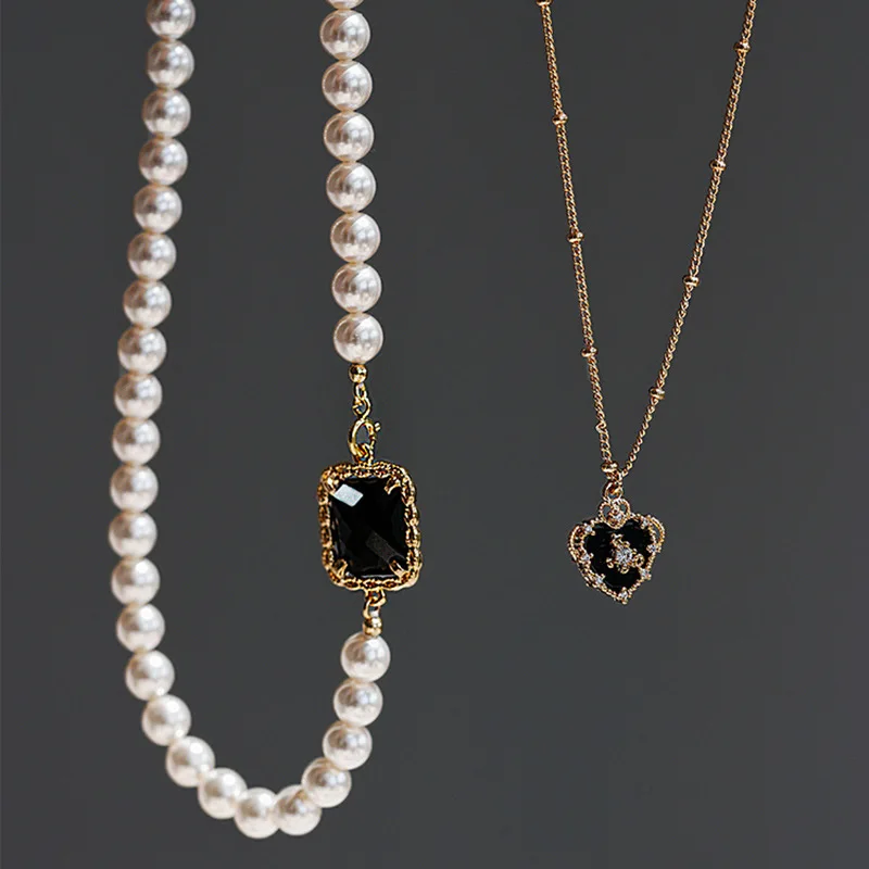 Korean version of the personality retro black gemstone pearl necklace female exquisite double love pendant necklace
Korean version of the personality retro black gemstone pearl necklace female exquisite double love pendant necklace