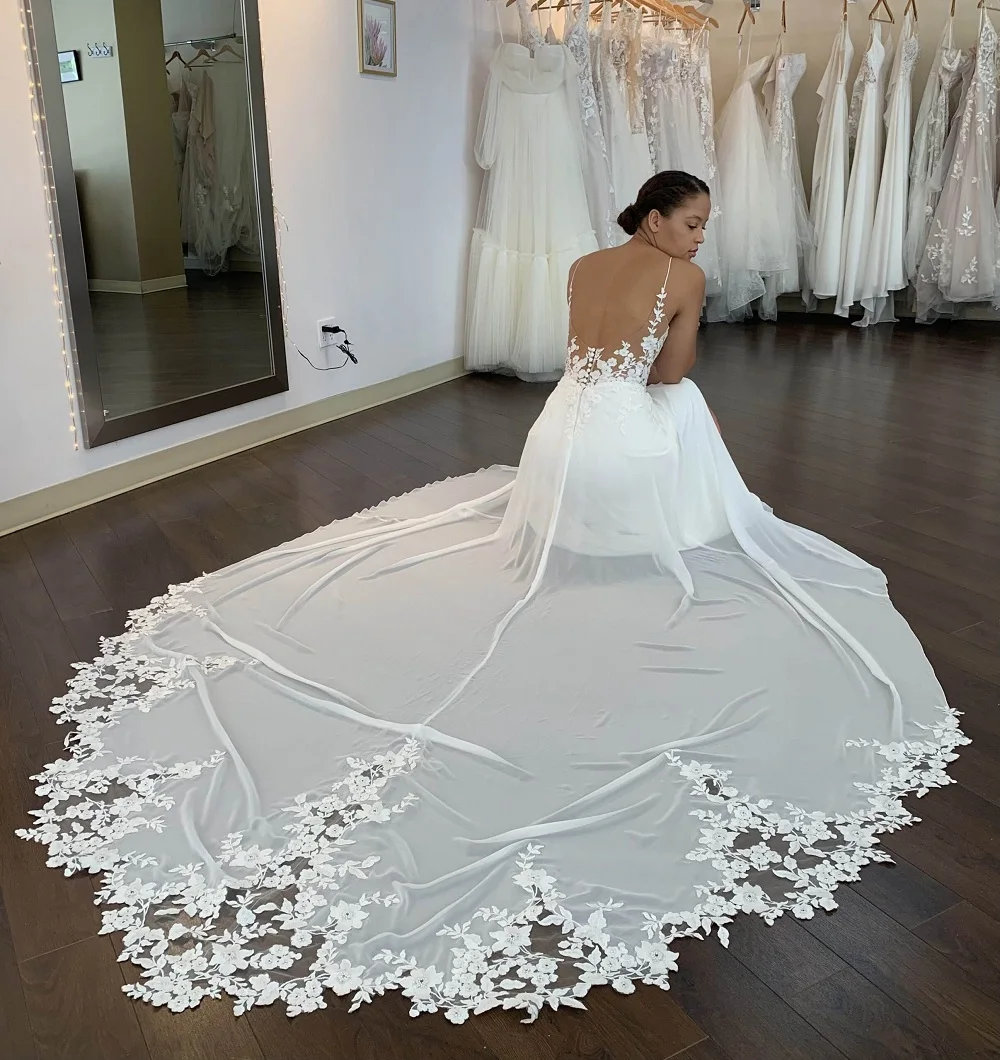 Mermaid Wedding Dresses Lace Appliques Deep V-neck Backless Bridal Gowns Long Train Wedding Gown Spaghetti Straps Bridal Dress 
Mermaid Wedding Dresses Lace Appliques Deep V-neck Backless Bridal Gowns Long Train Wedding Gown Spaghetti Straps Bridal Dress