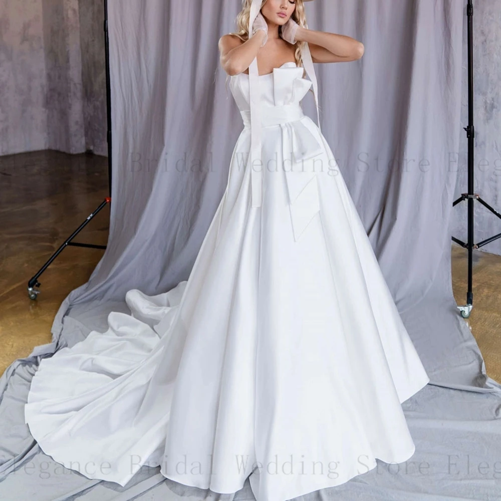 Elegant Long Strapless Wedding Dresses for Bride with White Satin Bow Sweep Train Wedding Gown Sleeveless Pleated vestidos
Elegant Long Strapless Wedding Dresses for Bride with White Satin Bow Sweep Train Wedding Gown Sleeveless Pleated vestidos
