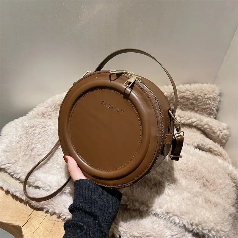 Женская круглая сумка через плечо, модная кожаная сумка, новинка 2022, дизайнерские женские сумки
Женская круглая сумка через плечо, модная кожаная сумка, новинка 2022, дизайнерские женские сумки