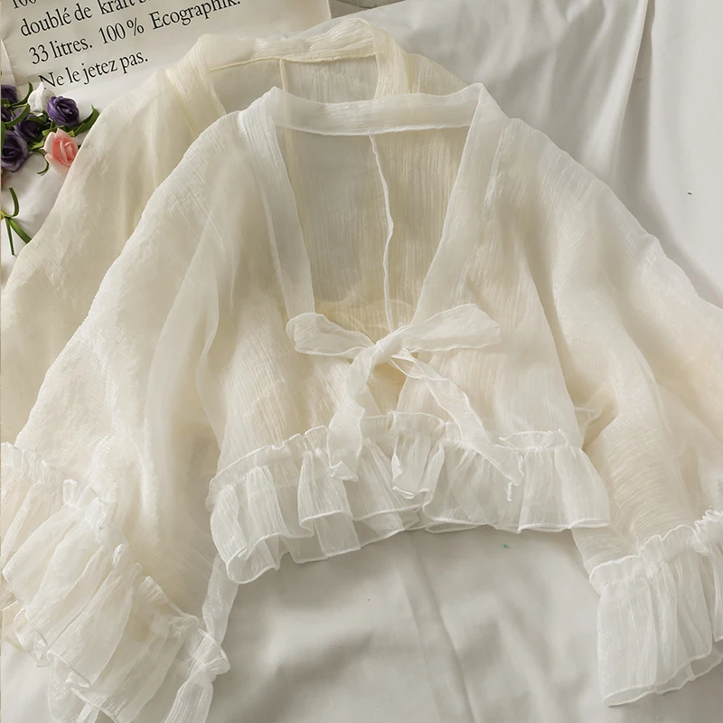 Новинка 2022, повседневные укороченные свободные топы, женская прозрачная шифоновая подкладка, белые кардиганы с оборками и бантом спереди 
Новинка 2022, повседневные укороченные свободные топы, женская прозрачная шифоновая подкладка, белые кардиганы с оборками и бантом спереди