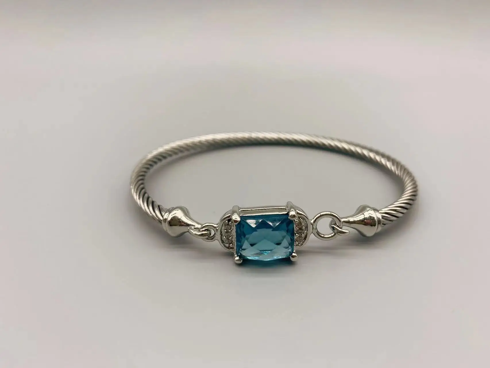 Le Han Jewelry Silver Cable Rectangle Center Blue Stone Bracelet With Cubic Zirconia 3mm
Le Han Jewelry Silver Cable Rectangle Center Blue Stone Bracelet With Cubic Zirconia 3mm