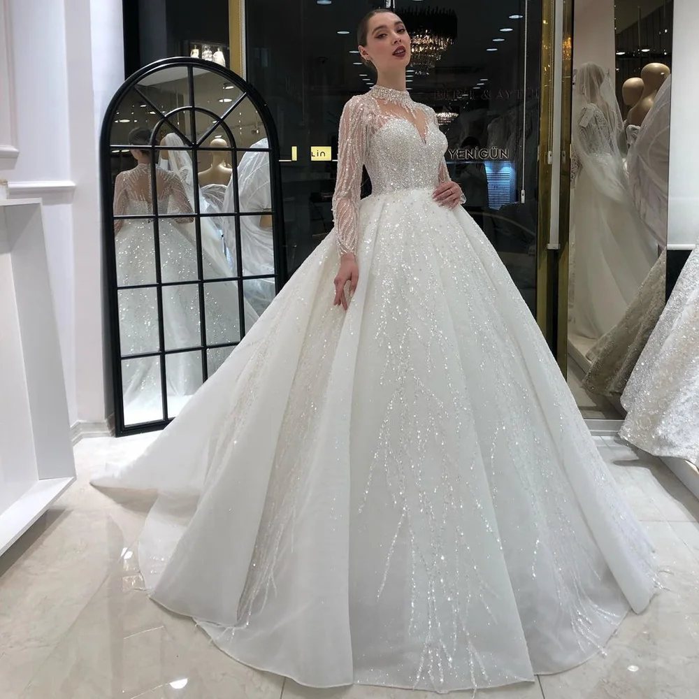 Elegant Illusion Long Sleeve Beading Sequined Dubai Ball Gown Wedding Dresses High Neck Crystal Diamond Saudi Arabic Bridal Gown
Elegant Illusion Long Sleeve Beading Sequined Dubai Ball Gown Wedding Dresses High Neck Crystal Diamond Saudi Arabic Bridal Gown